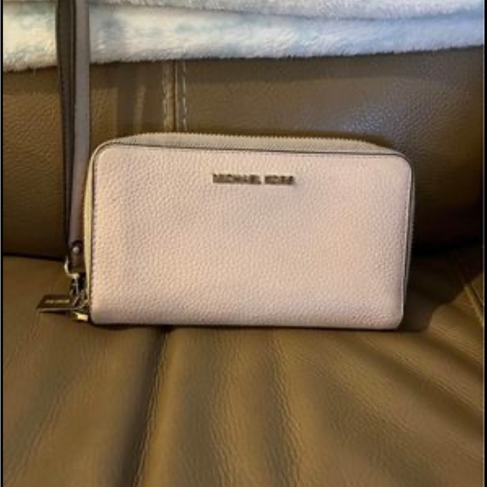 Michael Kors pink pebbles leather wristlet.